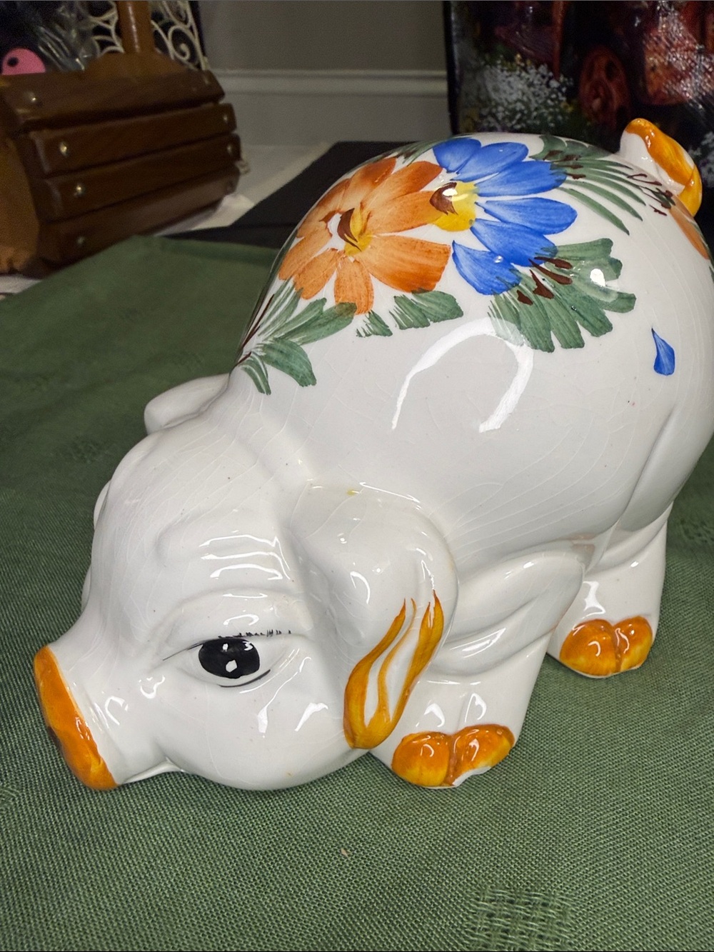 Hand-Painted White Ceramic Pig Figurine with Blue and Orange Floral Accents